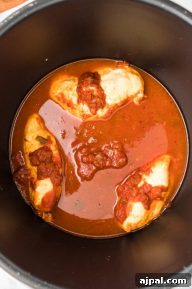 Perfectly cooked chicken breasts inside the Instant Pot after pressure cooking