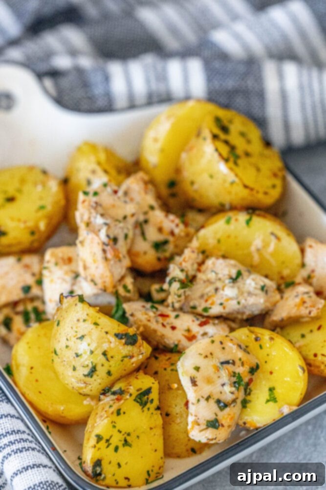 Zesty Lemon Garlic Chicken with Roasted Potatoes 6 A vibrant dish of lemon garlic chicken and potatoes with fresh parsley garnish.