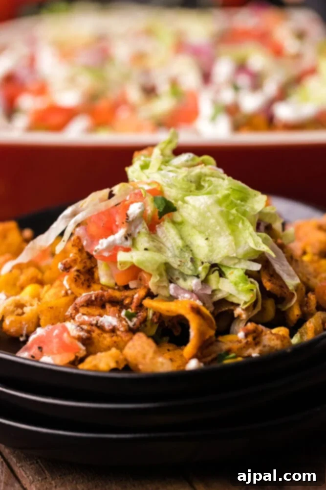 picture of frito pie casserole in a baking dish
