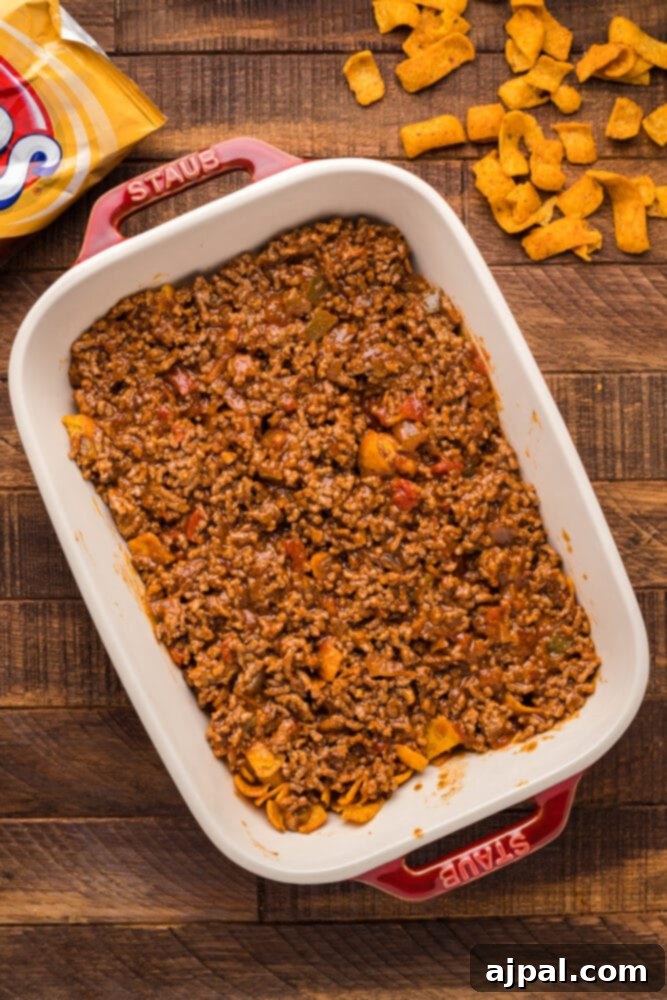 fritos and ground beef in a casserole dish