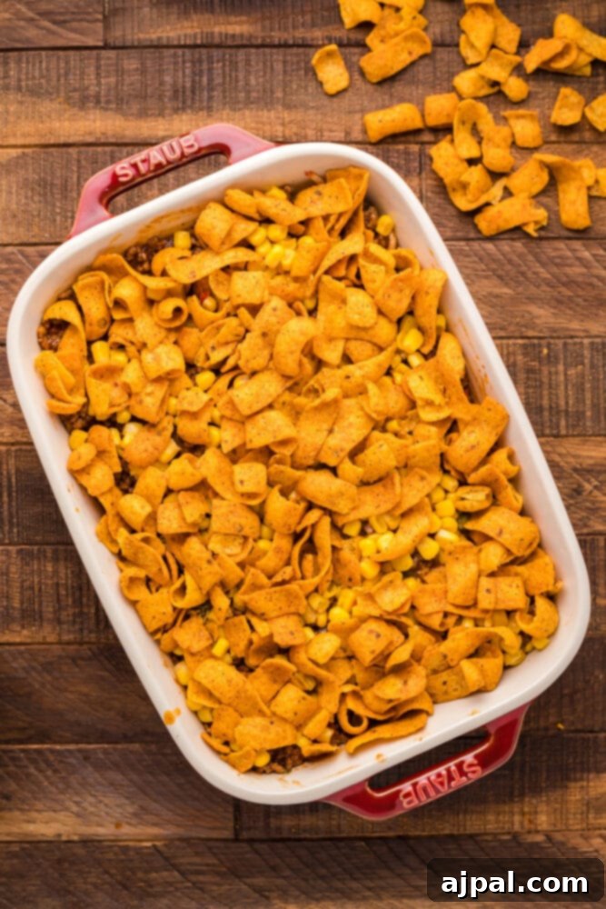 fritos corn beef and cheese in a casserole dish