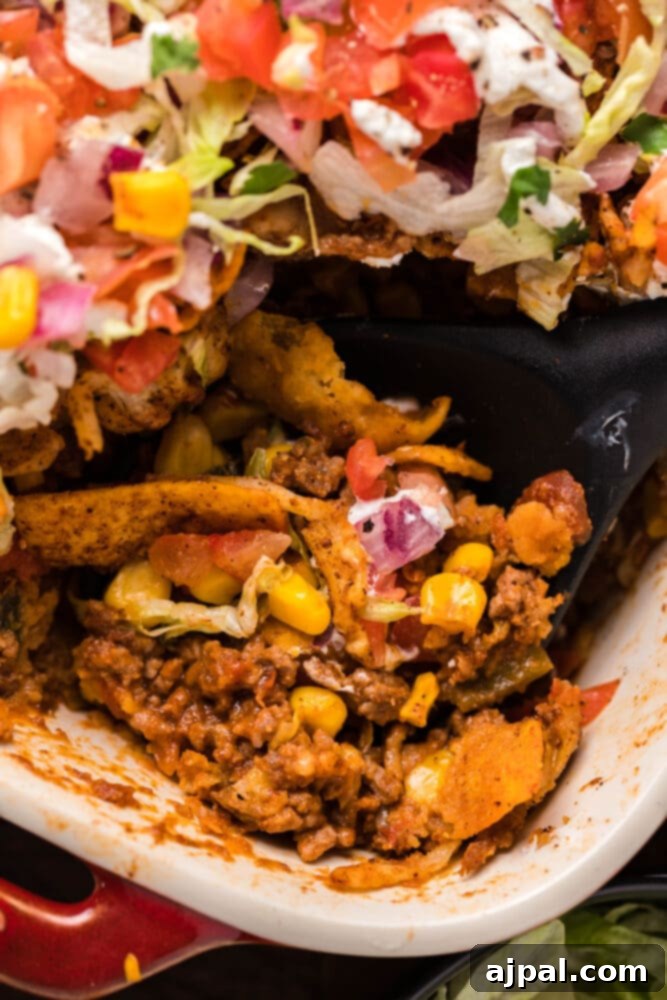 picture of frito pie casserole in a baking dish
