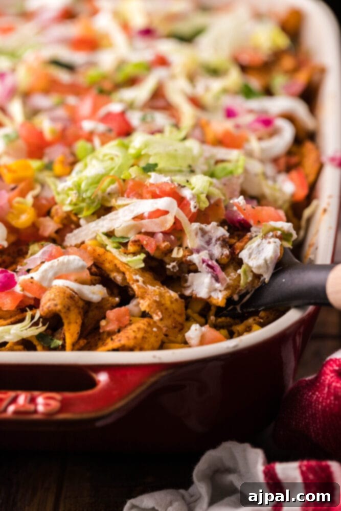 picture of frito pie casserole in a baking dish