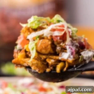 frito pie casserole on a spoon