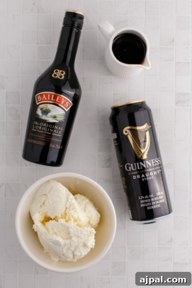 Guinness Baileys Float Delight 5 Baileys, Guinness, ice cream, and chocolate syrup on a table