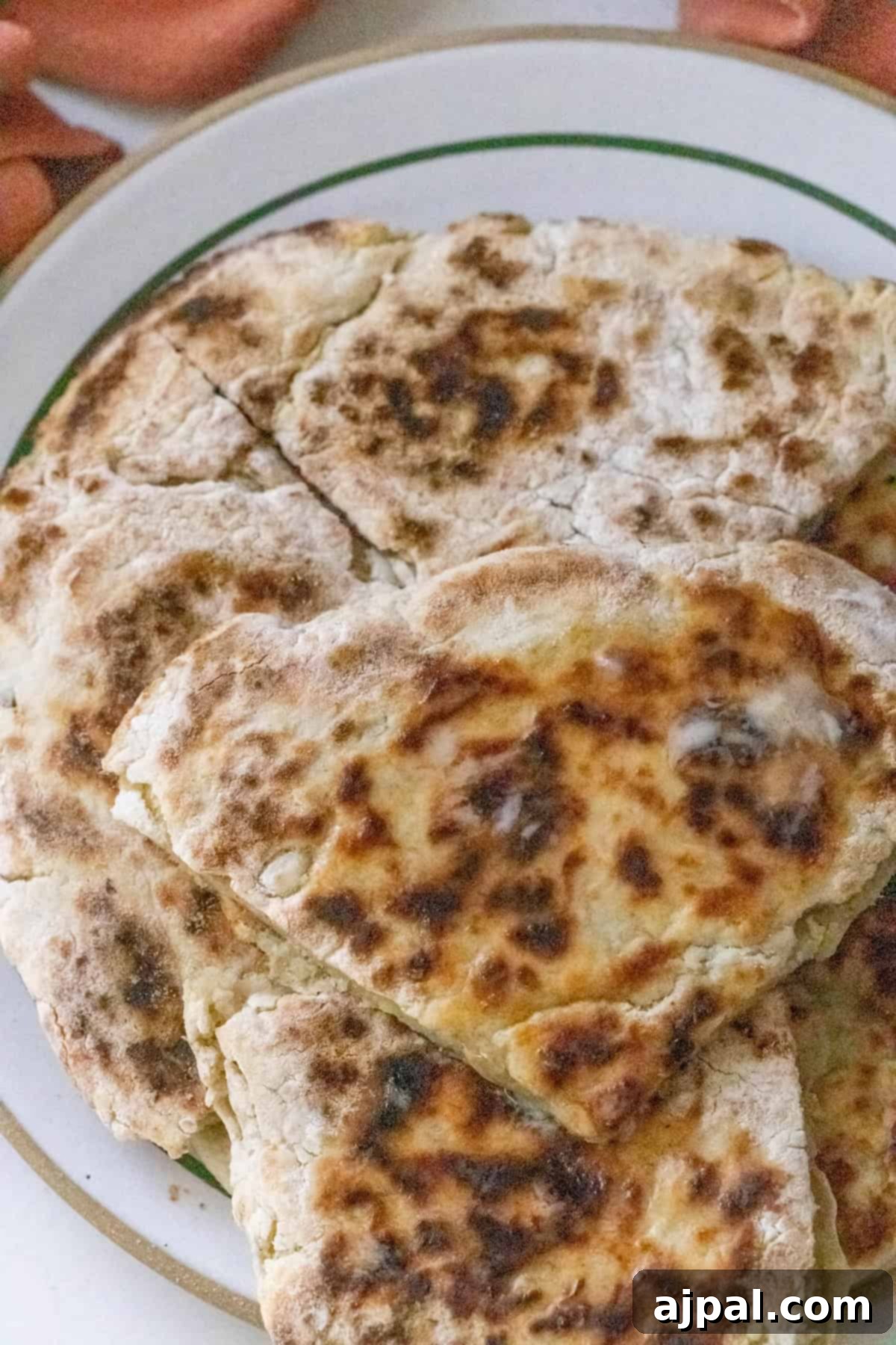 A plate of freshly baked farls potato bread slices with a golden-brown crust.