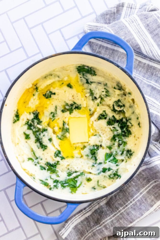 mashed potato and kale irish colcannon in a blue dutch oven
