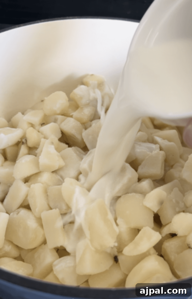 picture of milk and potatoes in a pan 