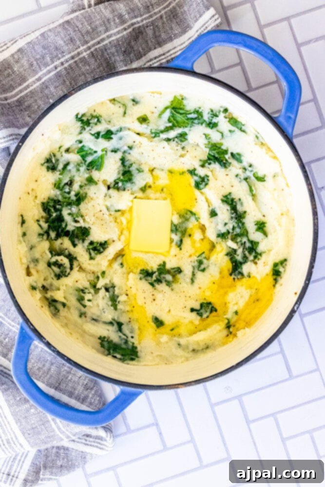 picture of mashed potato and kale irish colcannon in a blue dutch oven