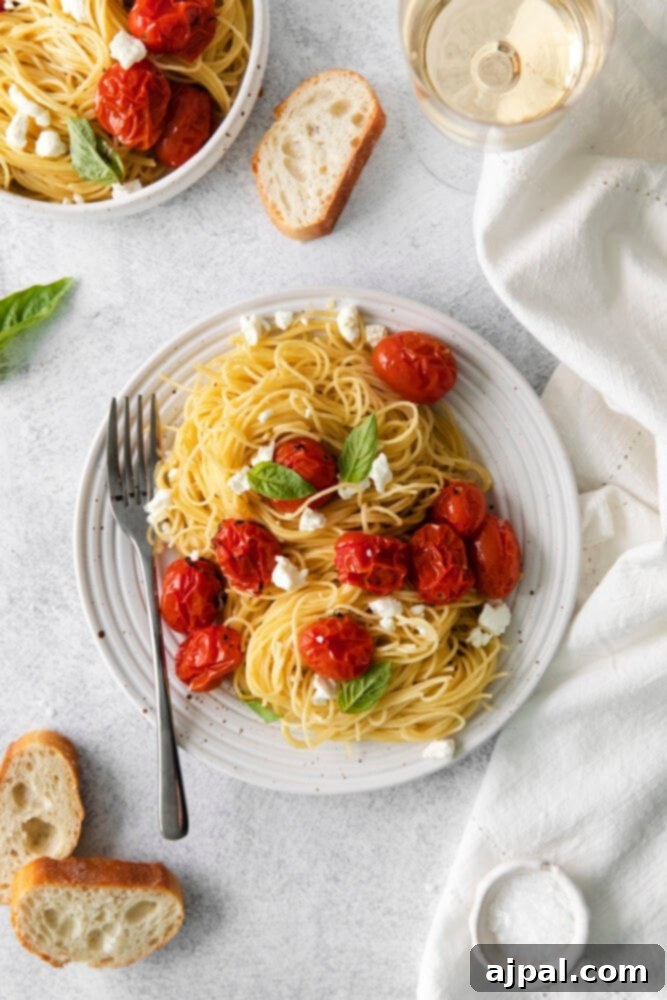 Creamy Goat Cheese and Roasted Tomato Pasta 10 A final, enticing view of the roasted tomato and goat cheese pasta on a white plate, highlighting its fresh ingredients and creamy texture before serving.
