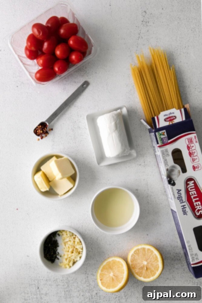 Creamy Goat Cheese and Roasted Tomato Pasta 4 A beautiful spread of fresh ingredients for the pasta dish, including dry pasta, creamy butter, tangy goat cheese, vibrant cherry tomatoes, and various aromatic herbs, neatly arranged on a rustic wooden surface.