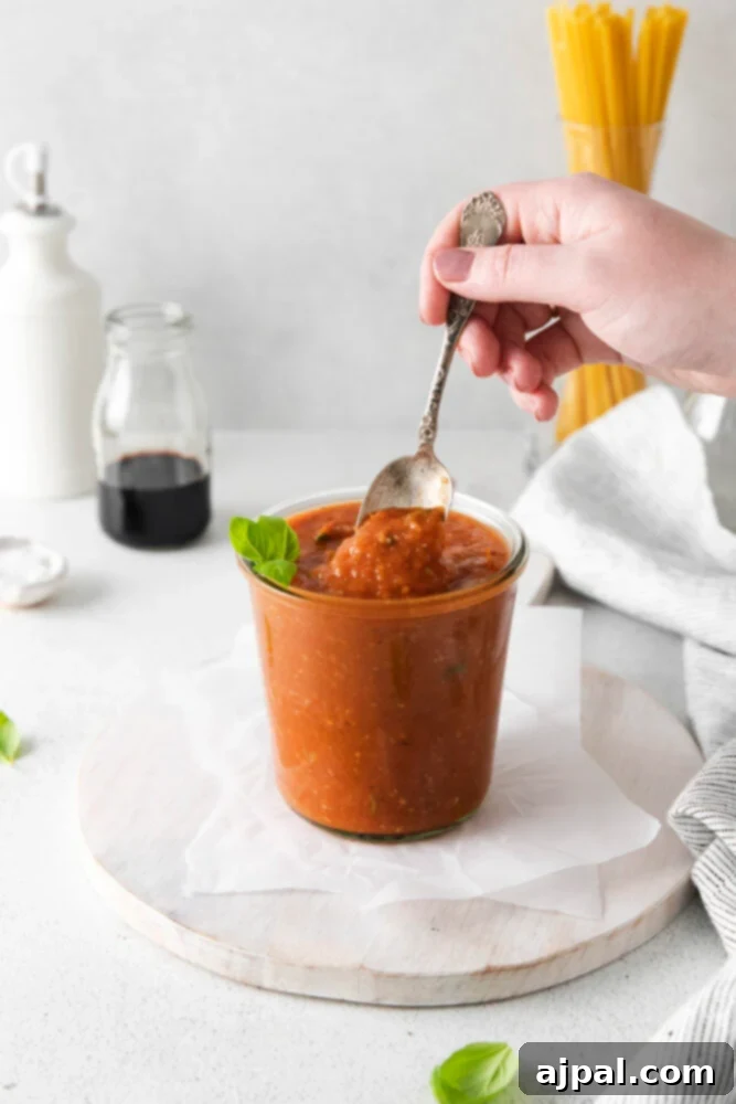 Deep Roasted Tomato Marinara 2 A beautiful jar filled with rich, red roasted tomato marinara sauce, ready to be enjoyed.