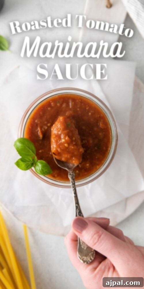 Deep Roasted Tomato Marinara 12 A wide shot of a jar of roasted tomato marinara sauce, showcasing its vibrant color and smooth texture.