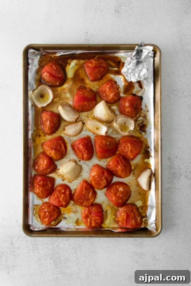 Deep Roasted Tomato Marinara 6 Caramelized roasted tomatoes and golden-brown onions on a baking sheet, fresh from the oven.