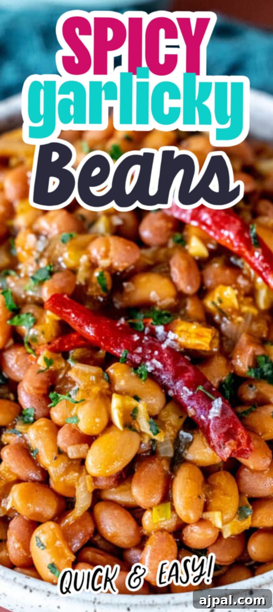 Chili Garlic Beans 9 Spicy garlicky beans served on a white plate, highlighting their rich texture and appealing presentation.