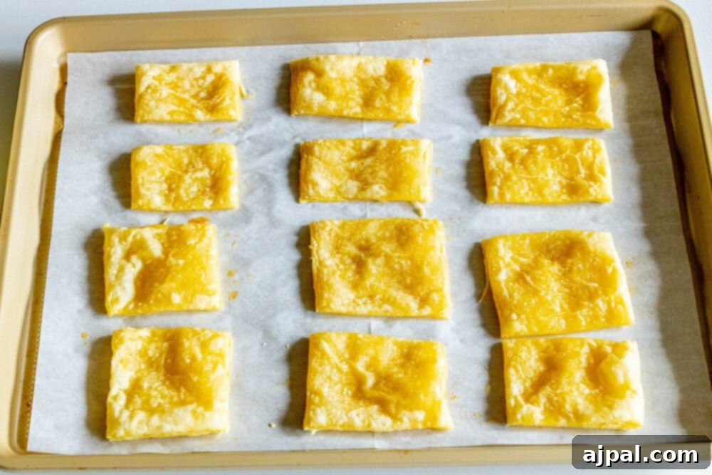 Bright Lemon Berry Tarts 5 Picture of parbaked puff pastry squares, lightly browned and ready for fillings.