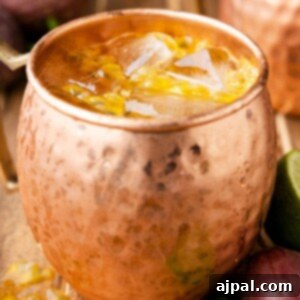 picture of passion fruit dark and stormy in copper mug