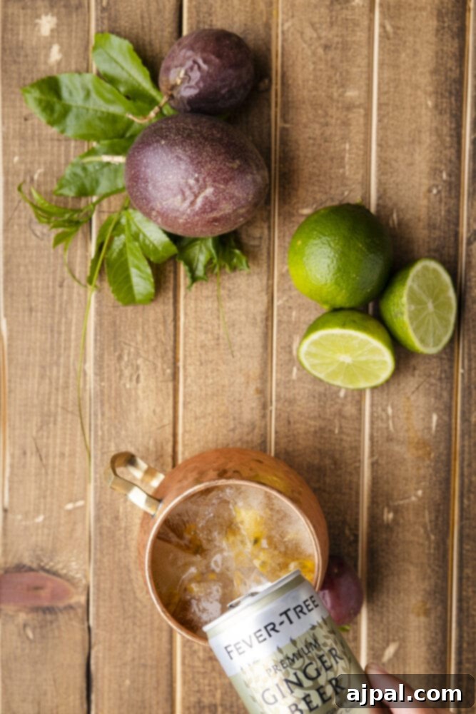 Passion Tempest 9 The final step: topping a cocktail in a copper mug with ginger beer.