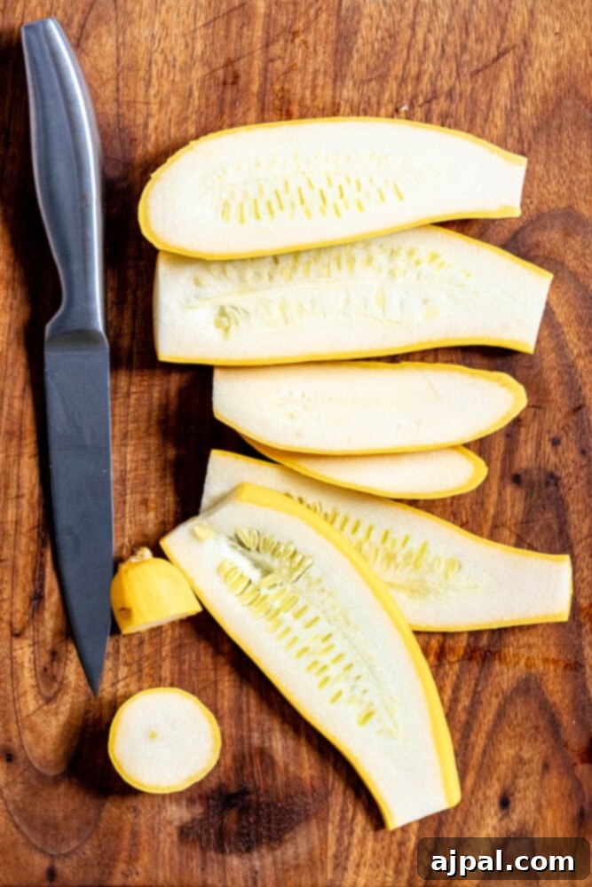 Grilled Summer Squash Medley 5 picture of sliced yellow squash and a knife on a cutting board