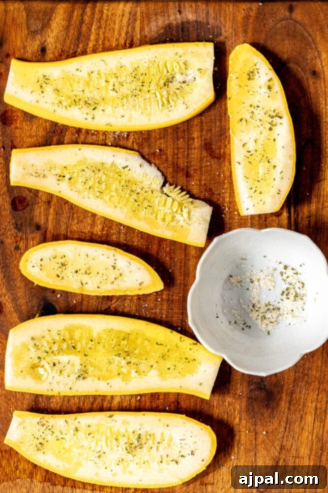 Grilled Summer Squash Medley 7 picture of seasoned slice squash on a cutting board