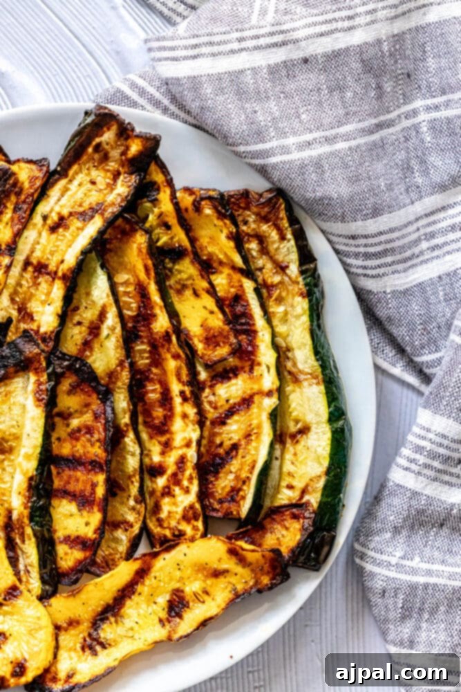 Grilled Summer Squash Medley 10 picture of grilled zucchini and squash on a white plate