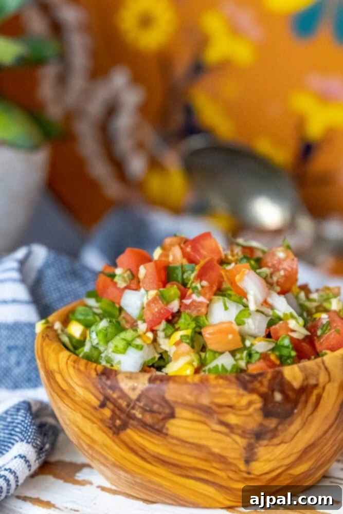 Whip Up Corn Pico De Gallo 5 A bowl of Mexican salsa with corn pico de gallo, vibrant and fresh.