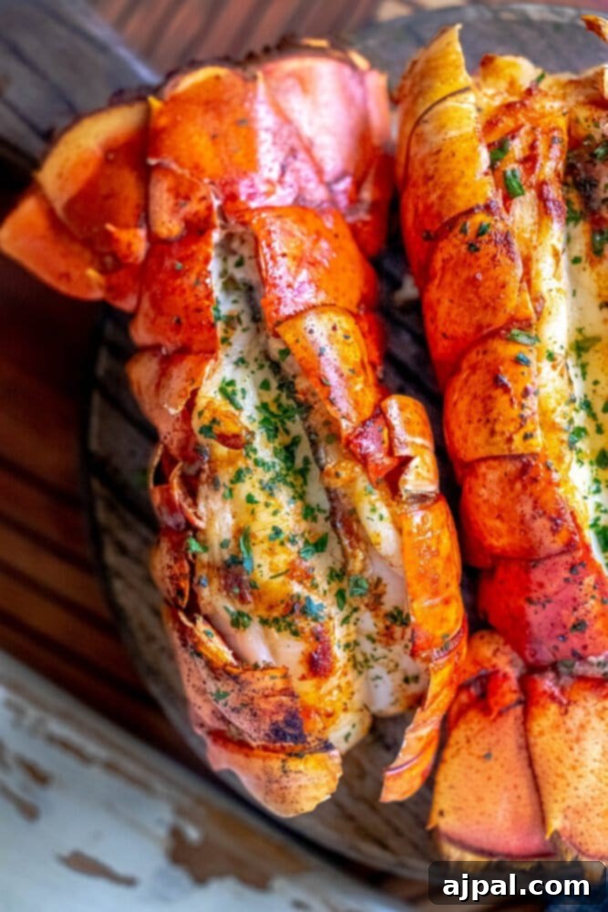 Perfect Grilled Lobster Tails 9 Close-up of a beautifully cooked lobster tail with melted butter.