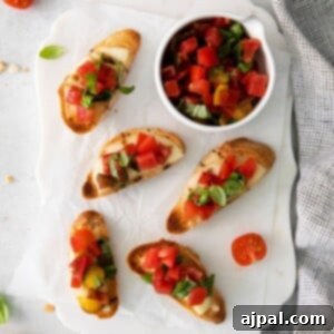 Beautifully arranged Caprese Bruschetta on a plate, ready to serve.