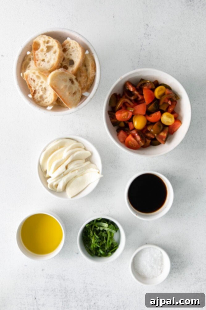 Fresh Caprese Bruschetta 4 An organized display of fresh Caprese Bruschetta ingredients: baguette slices, ripe tomatoes, mozzarella cheese, fragrant basil, olive oil, and balsamic vinegar on a wooden surface.