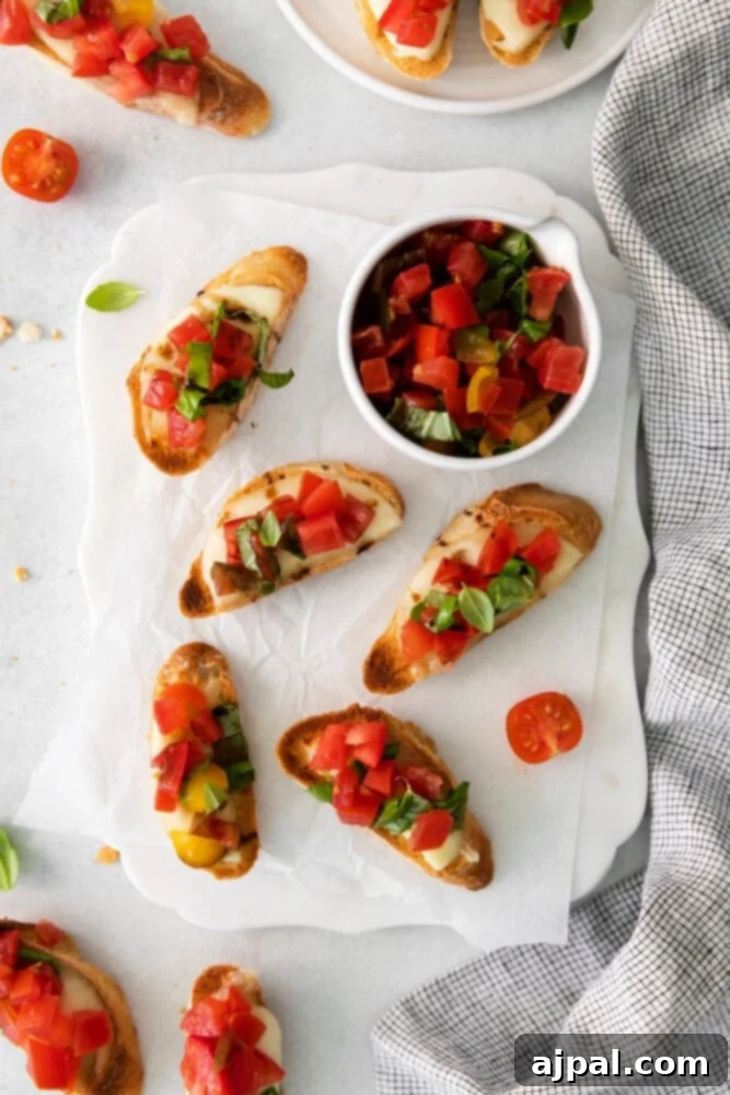 Vibrant Caprese Toasts 8 A tray filled with freshly prepared Caprese Bruschetta, artfully garnished with basil and a sprinkle of sea salt.