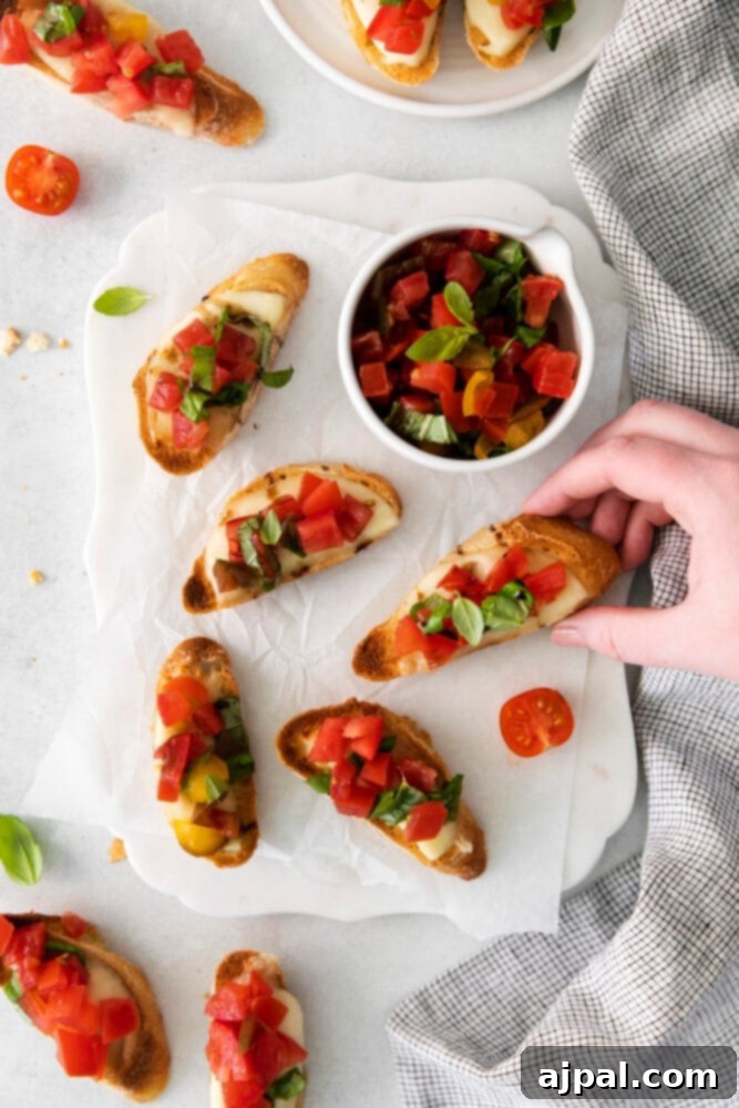 Vibrant Caprese Toasts 9 A stunning plate of Caprese Bruschetta featuring vibrant tomatoes and creamy mozzarella on toasted bread, ready to be enjoyed.