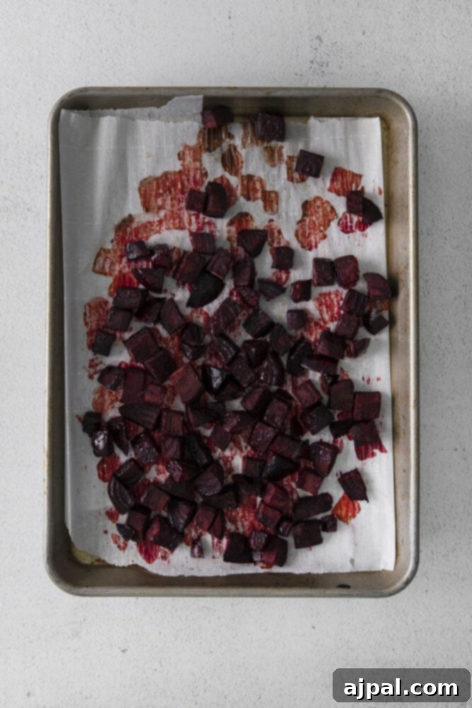 Vibrant Roasted Beet Hummus 5 picture of roasted beets on a baking sheet