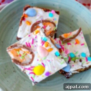 Easter fudge bars adorned with colorful sprinkles and Cadbury eggs.
