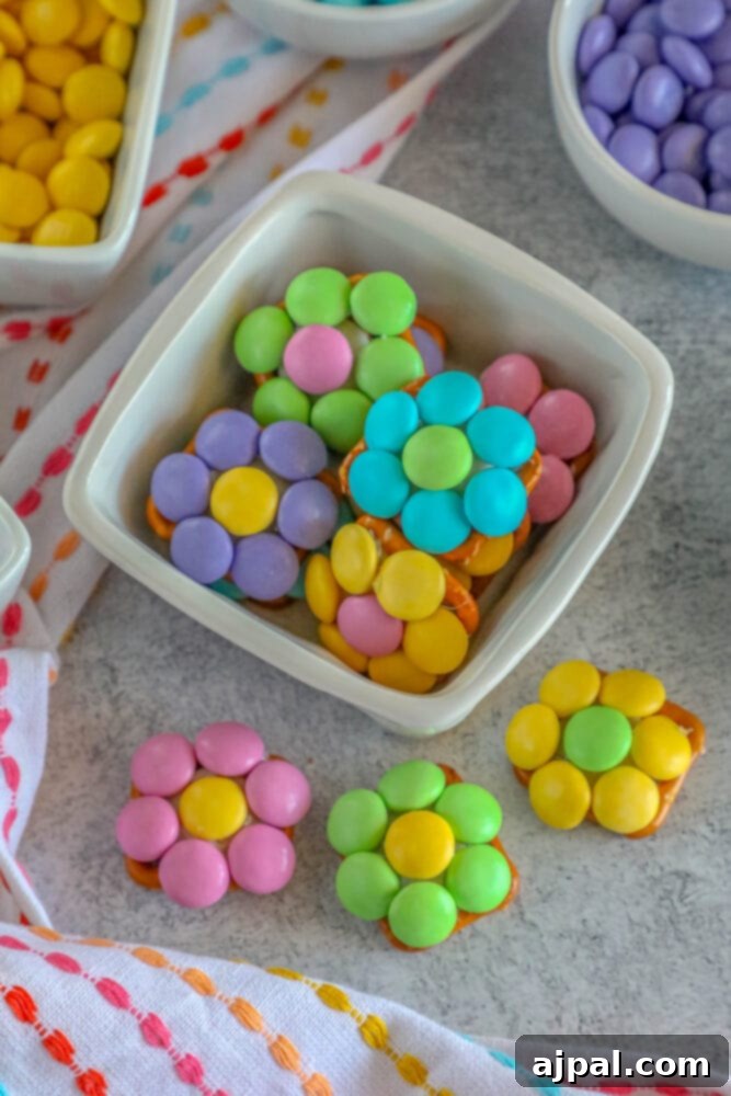Hoppy Easter Pretzels 8 Fully decorated Easter pretzel snacks with colorful candies arranged as flowers.