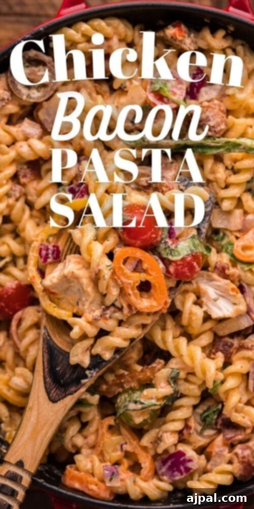 Velvet Chicken Bacon Pasta Salad 14 A close-up view of creamy chicken bacon pasta salad served in a skillet.