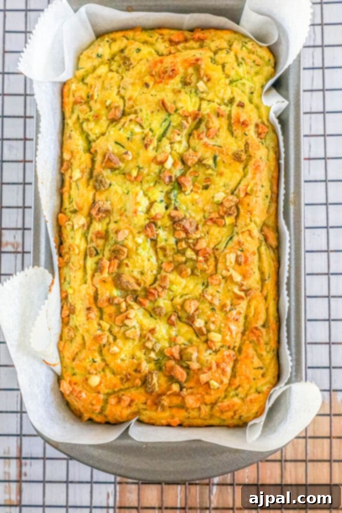 Keto Zucchini Pistachio Loaf 6 picture of pistachio zucchini bread sliced on parchment paper