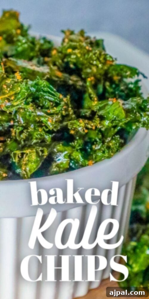 A white bowl brimming with beautifully baked kale chips, prepared with an incredibly easy recipe, ready to be enjoyed.
