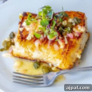 Picture of Chilean seabass with lemon caper butter on a plate with a fork