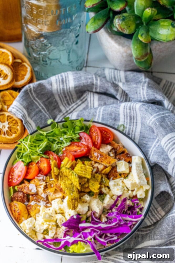 Spicy Jalapeno Chicken Thigh Salad 5 A hearty and spicy Crispy Jalapeno Chicken Thigh Salad, featuring a colorful array of fresh vegetables, tender chicken, and crispy elements.