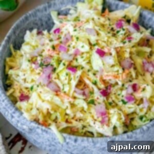Quick & Easy 4-Ingredient Coleslaw 9 picture of coleslaw in a blue bowl