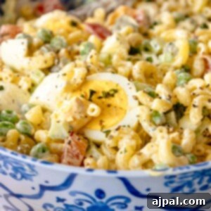 A serving of The Best Macaroni Salad, showcasing its creamy texture and fresh ingredients