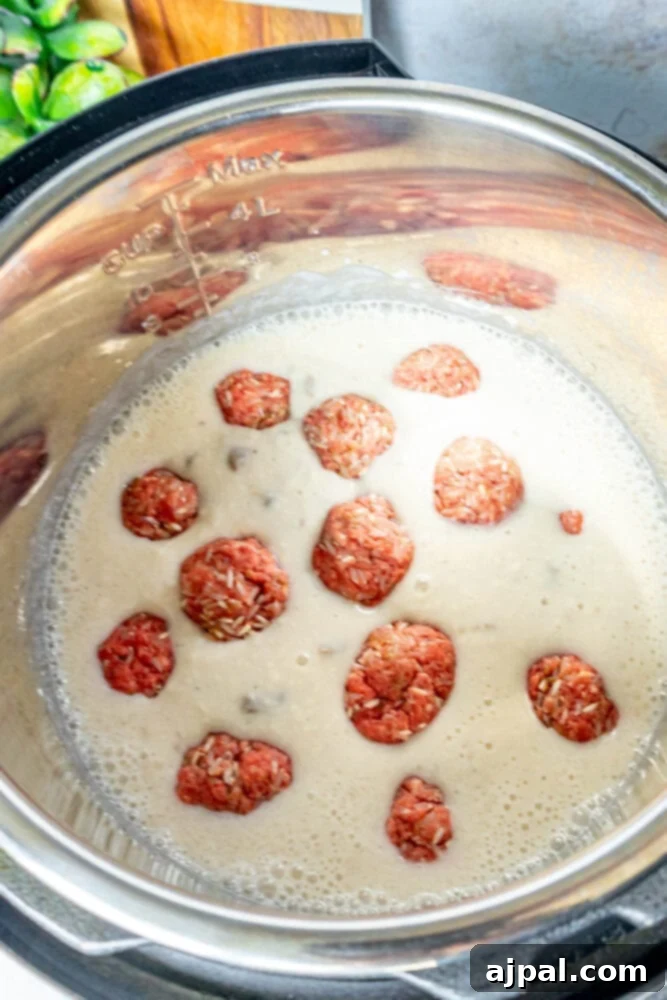Easy Creamy Instant Pot Porcupine Meatballs 9 picture of porcupine meatballs in mushroom soup in an instant pot