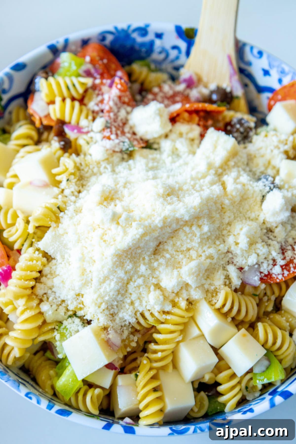 A blue and white bowl filled with The Best Easy Pasta Salad.