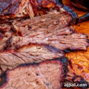 Hot and Fast Brisket Made Easy 12 picture of smoked brisket on a wooden cutting board