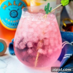 Picture of pink gin and tonic on a table
