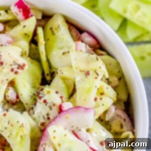 Cool Creamy Cucumber Salad 14 picture of creamy cucumber salad with mustard and mayonnaise in a bowl