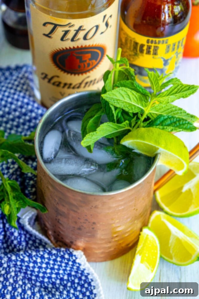 Moscow Mule Zesty Ginger Delight 5 A picture of a refreshing Moscow Mule cocktail expertly crafted and served in a shiny copper mug, garnished with a lime wedge and a sprig of fresh mint, set on a wooden table.