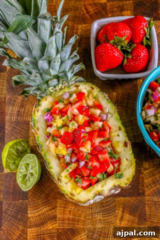 Close-up of pineapple and strawberry salsa, with a hint of lime, served in a pineapple shell.