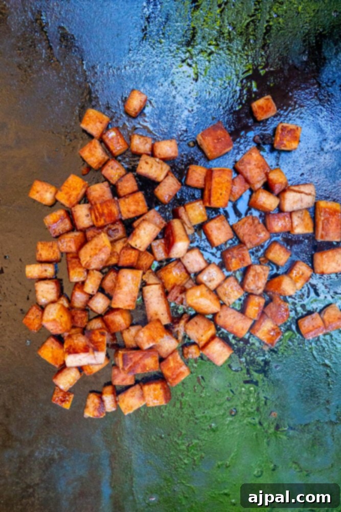 Effortless Spam Fried Rice 5 picture of spam frying on a griddle