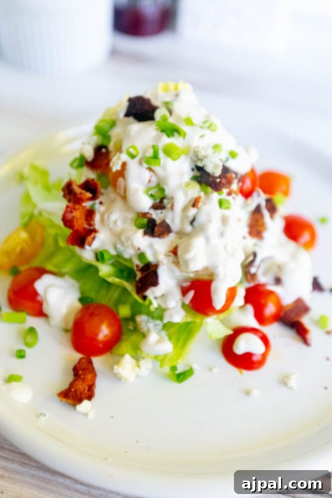 Classic Wedge Salad with Creamy Blue Cheese Dressing 5 Salad with green onions, tomatoes, bacon, and crumbled blue cheese dressing